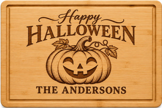 Personalized Halloween cutting board engraved with a jack o lantern, fall leaves and family name on bamboo